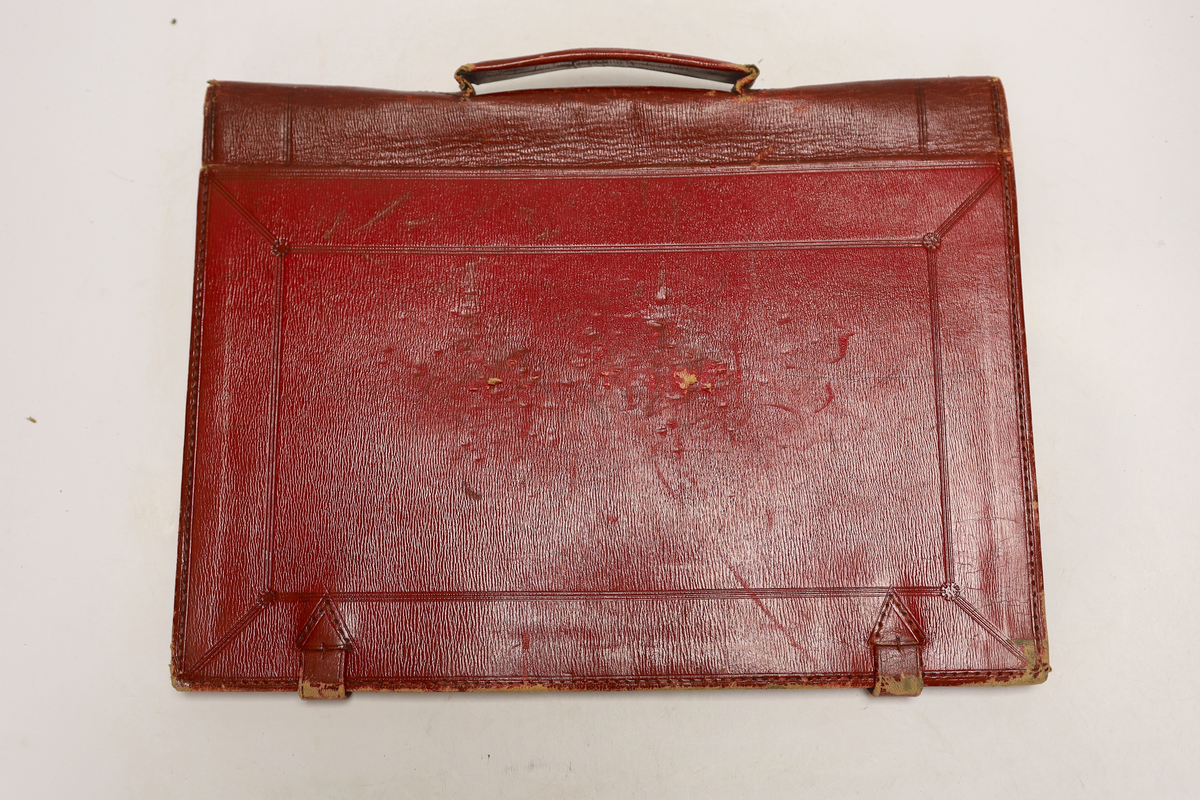 A vintage Moroccan red leather briefcase used by Willie Kendall in ‘Diplomacy’, Wickwar Manufacturer, Poland street, London, with handwritten letters